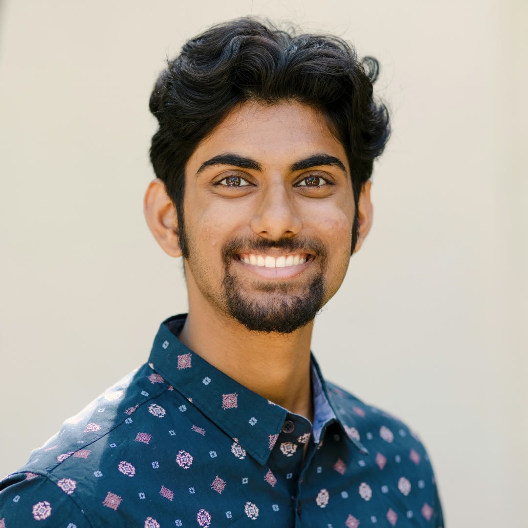 Portrait of a smiling man in a patterned shirt
