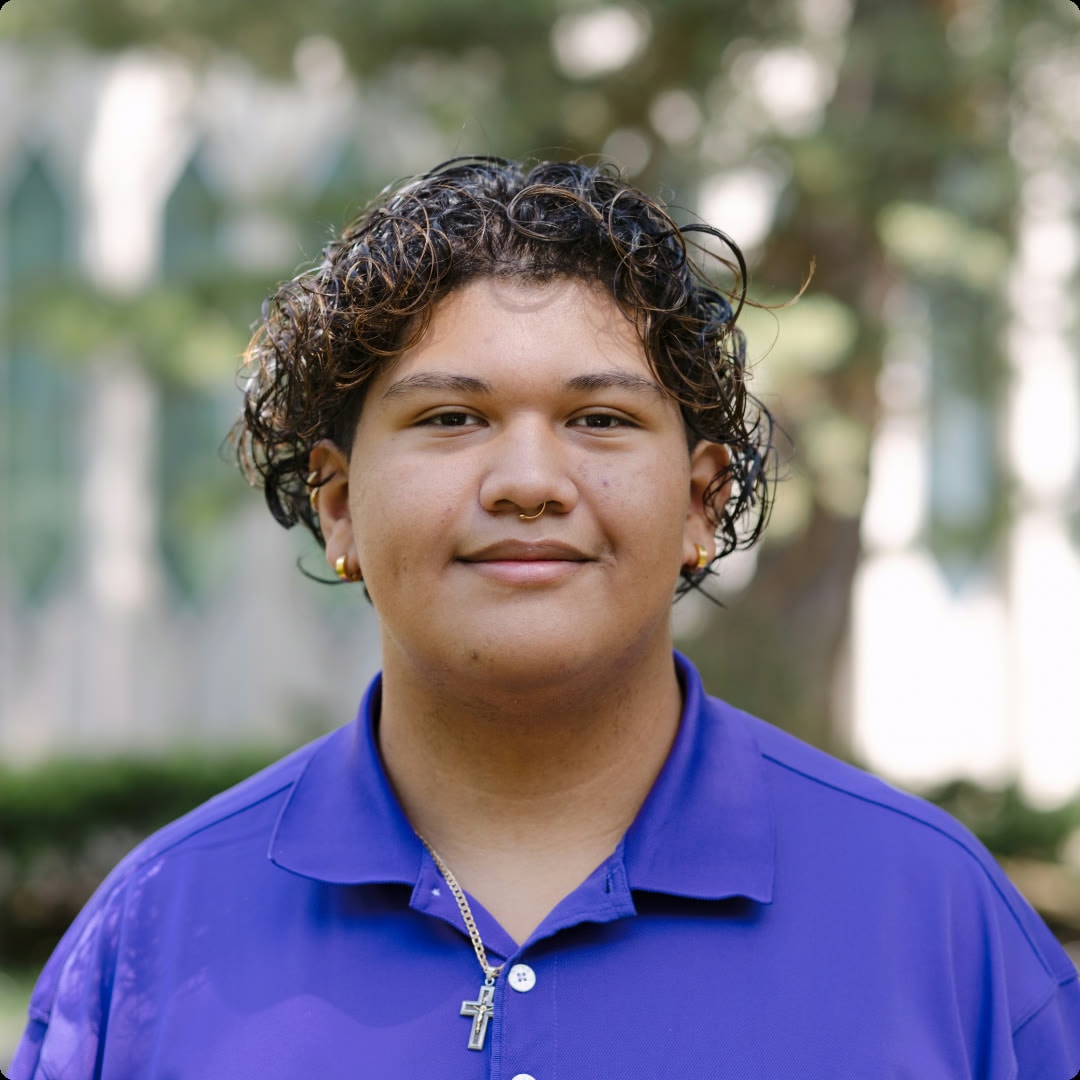 Outdoor portrait of a person in a purple polo